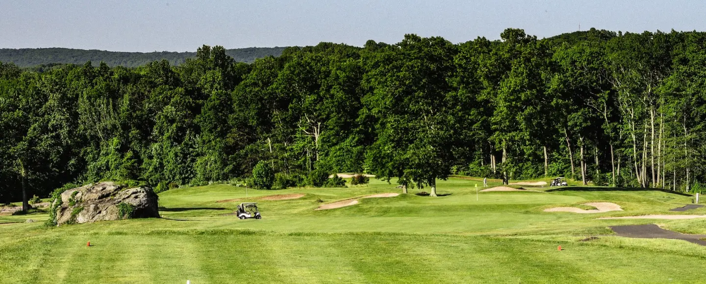 Golfer teeing off on The VUE's championship golf course in Hamden, CT