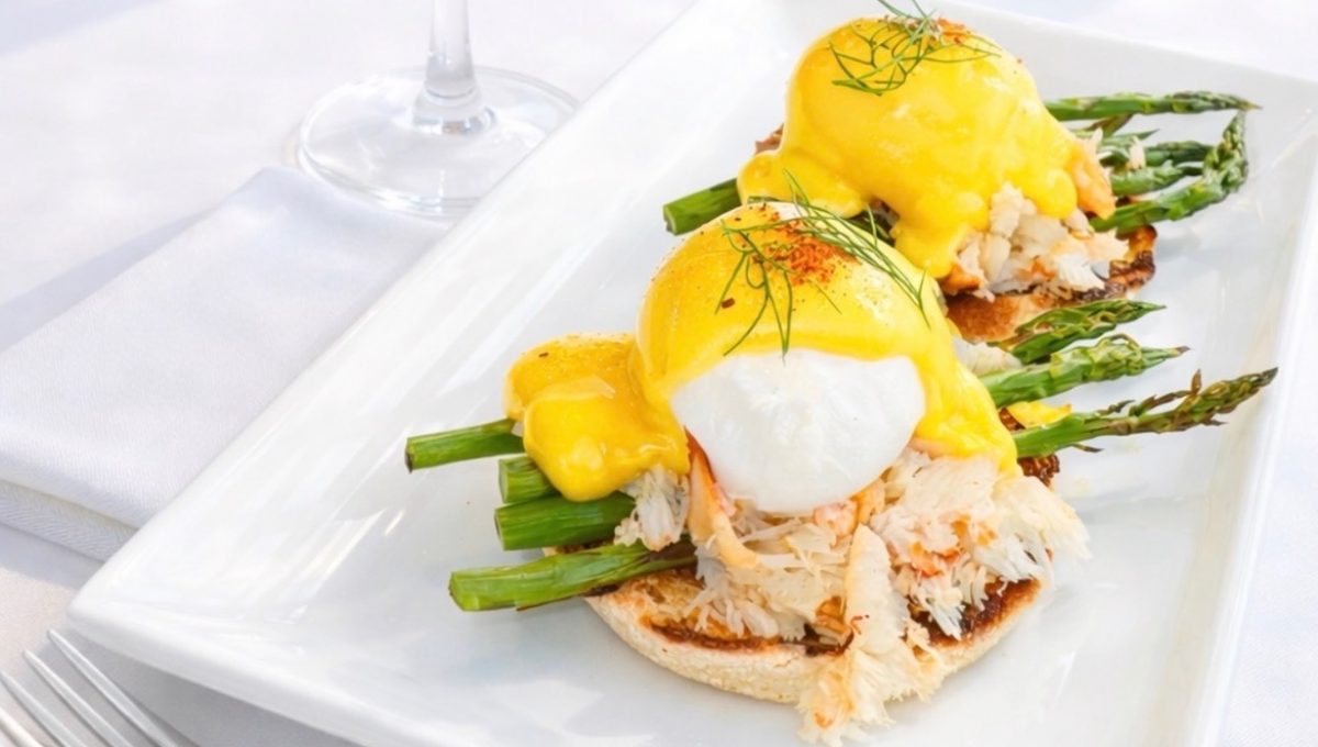 Crab eggs Benedict over asparagus with hollandaise and fresh dill, served at The VUE