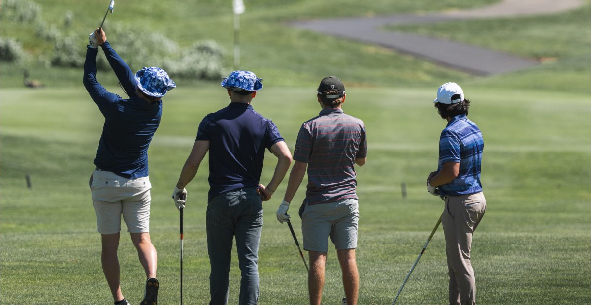 Group of golfers watching a tee shot during a golf outing at The VUE